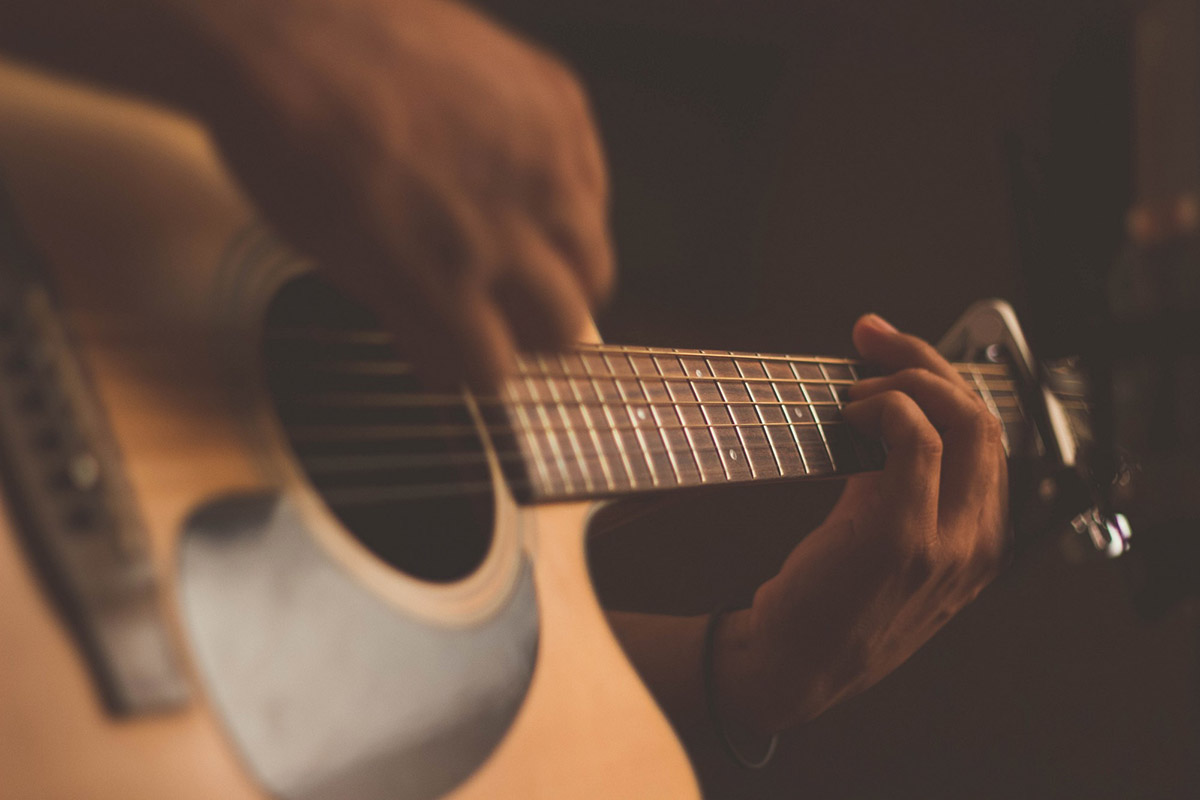 Hand strumming guitar